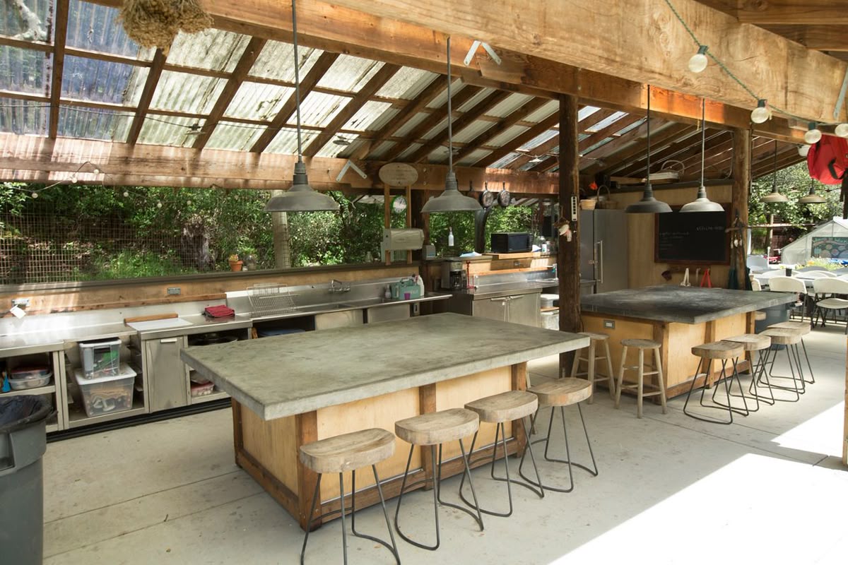 An open communal kitchen with a long counter